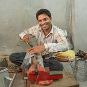 Anwar Saleem, a man in a blue shirt.